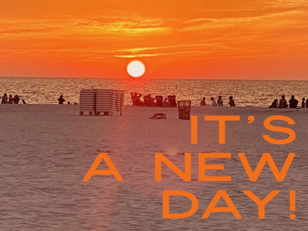 a poster saying “IT”S A NEW DAY!”