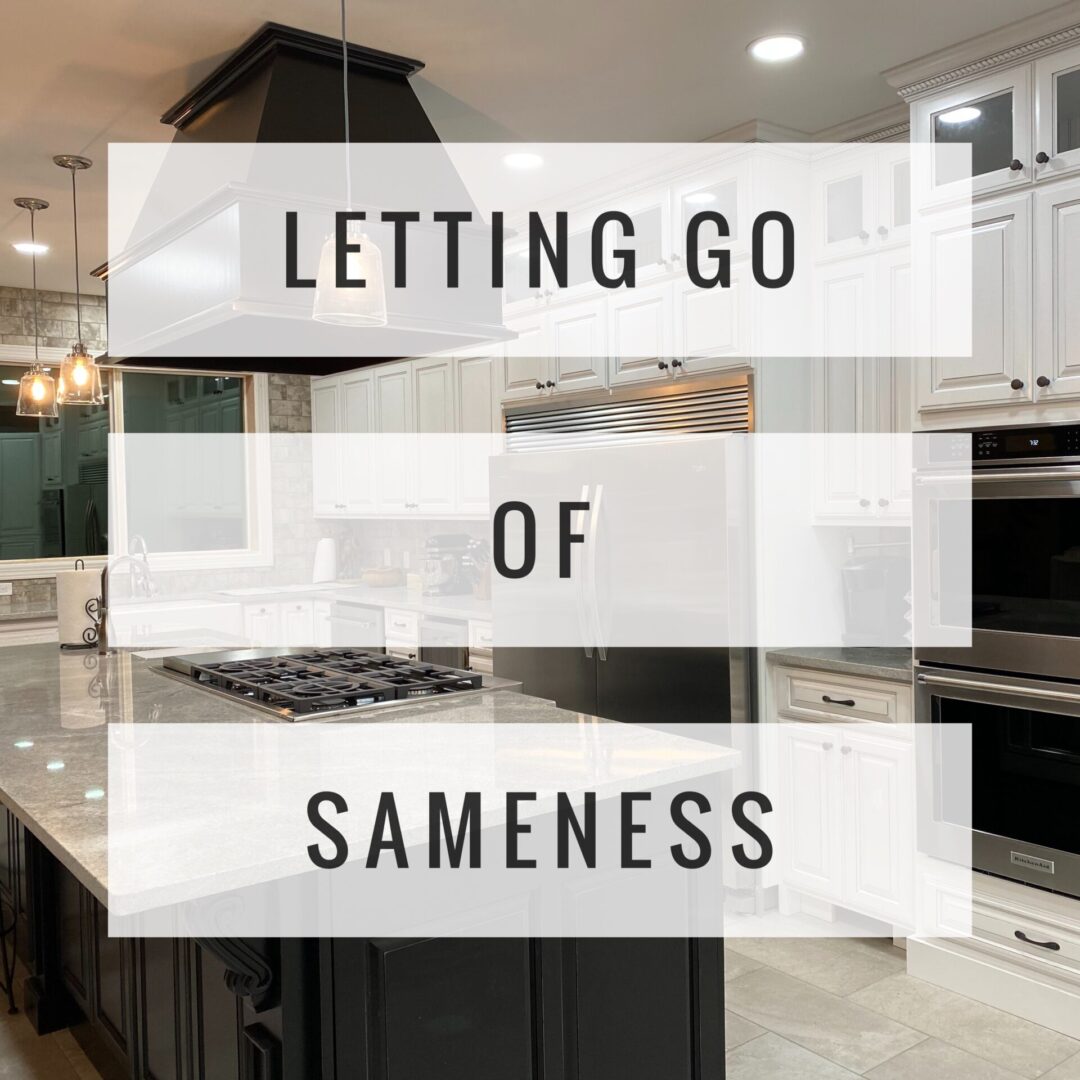 a poster saying LETTING GO OF SAMENESS with a kitchen in the background