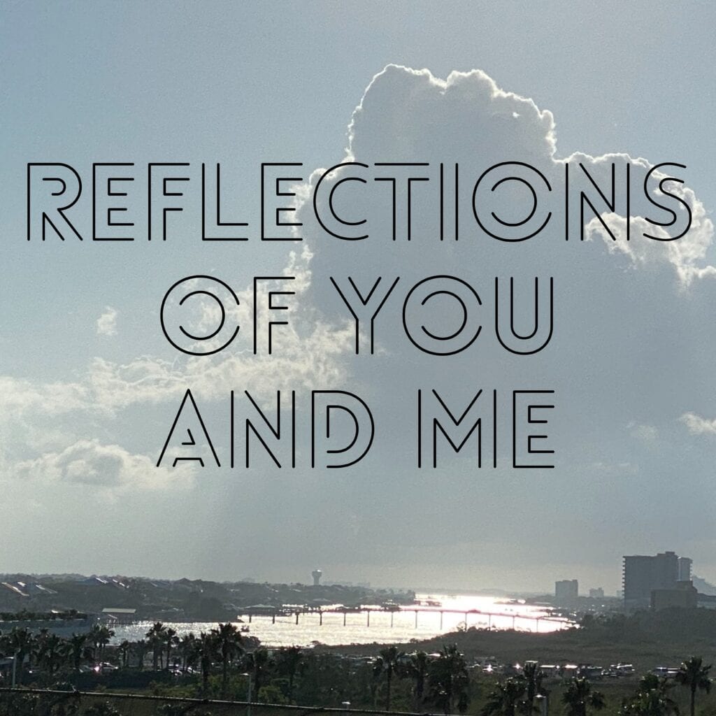 a photo of a city sky with text saying REFLECTIONS OF YOU AND ME