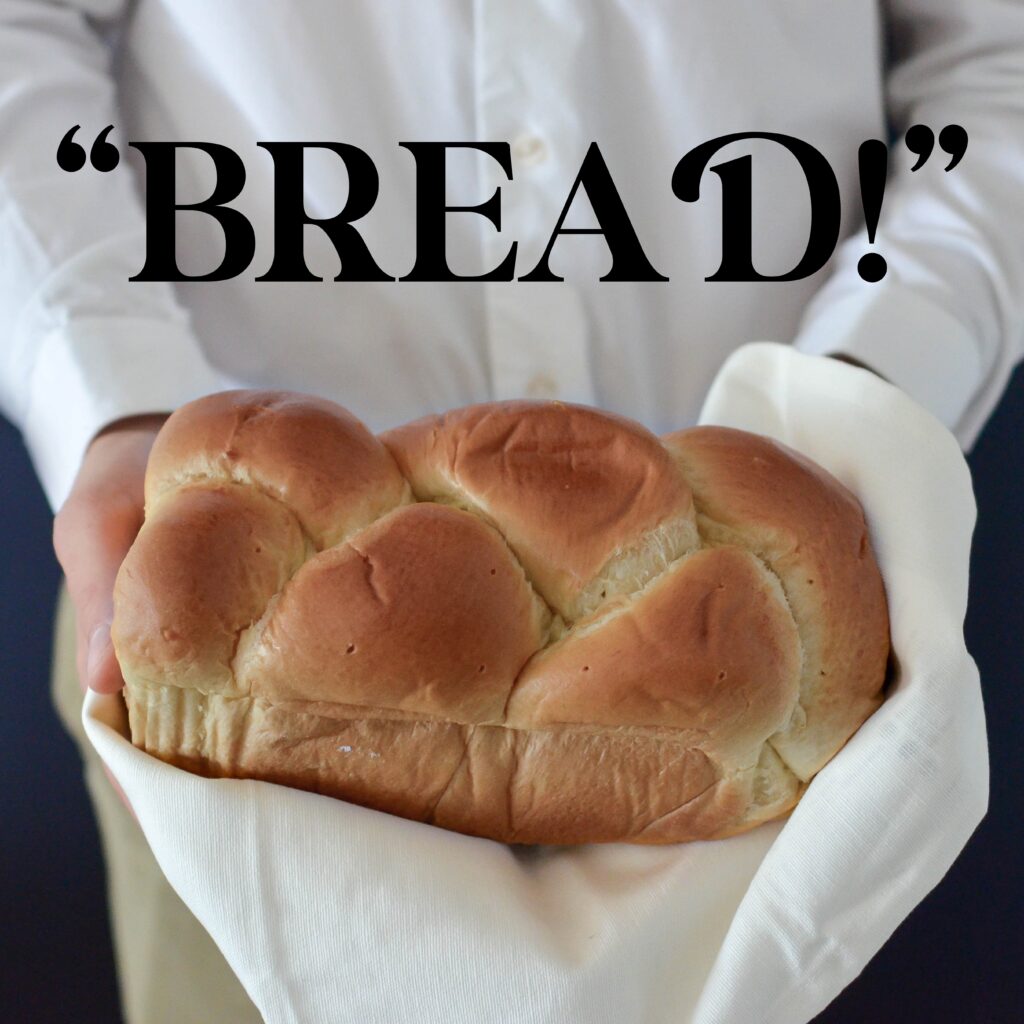 Chef Holding Fresh Hot Bread In The Image