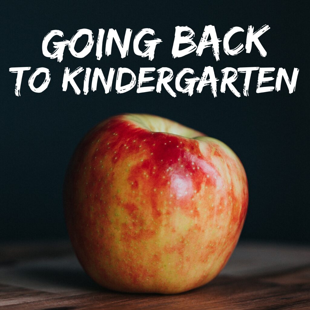 Going Back to Kindergarten Written In White Text