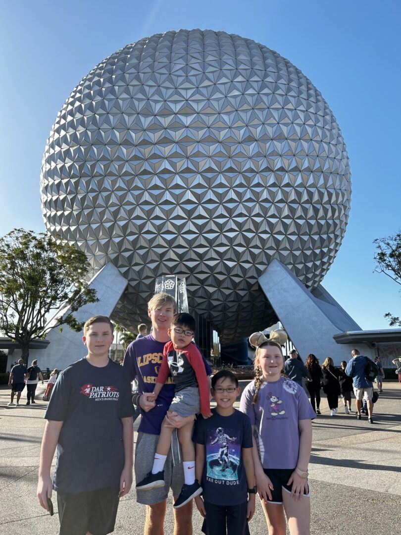 IMG_1958 A group of people standing in front of an attraction.