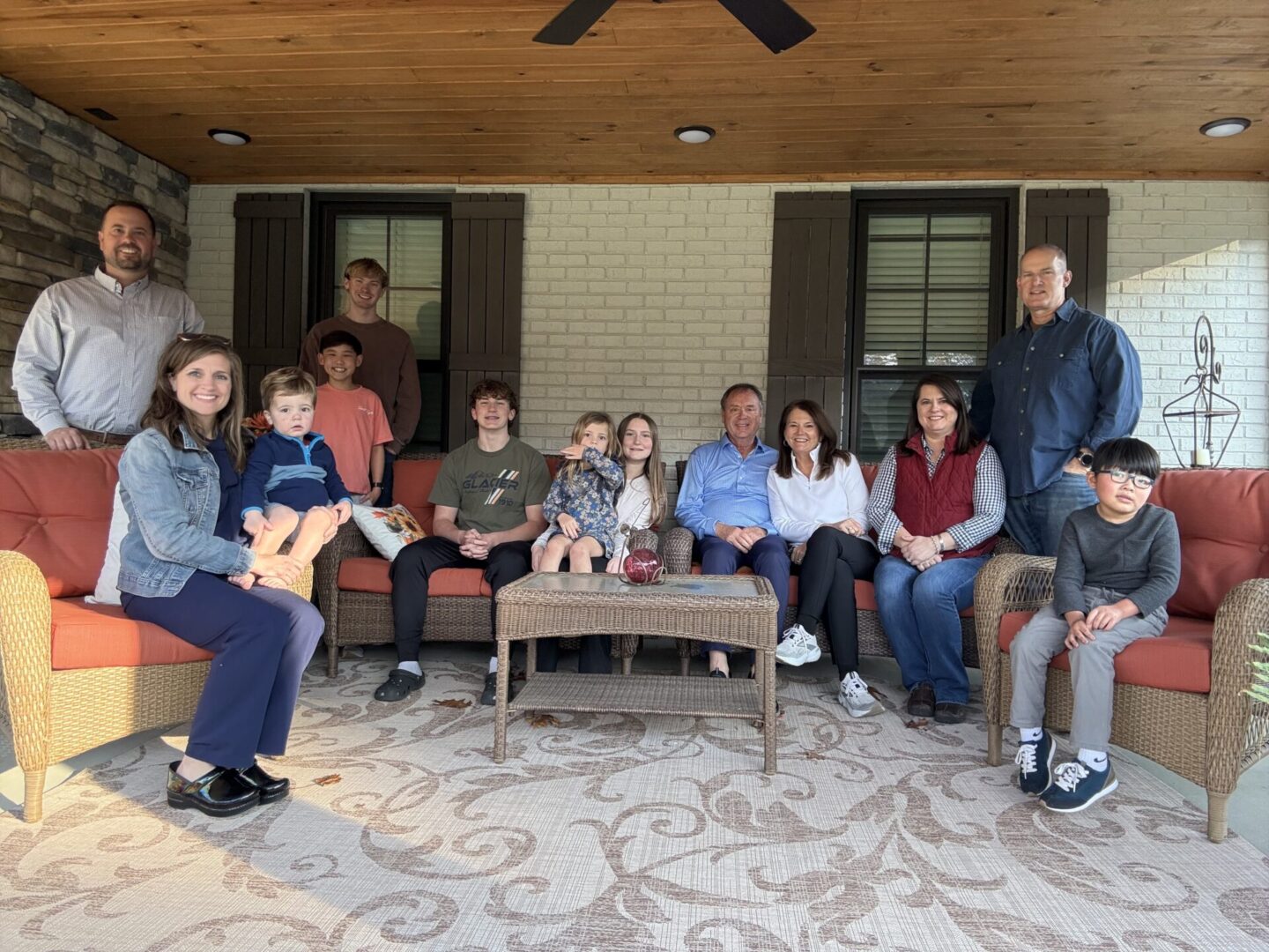 A group of people sitting on top of a couch.